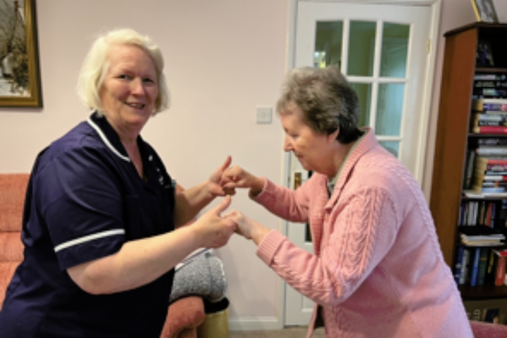 Anglea and lesley dancing while Radfield Home Care Worcester provides respite care and dementia support in worcester
