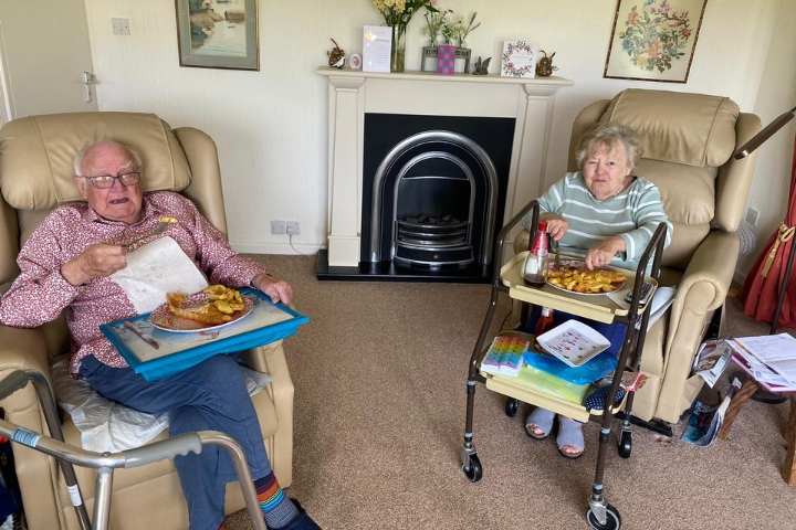 radfield home care clients eat fish and chips at home helped by Radfield