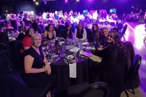 Radfield Home Care Wakefield & Huddersfield team celebrating their success at the Great British Care Awards, smiling together.